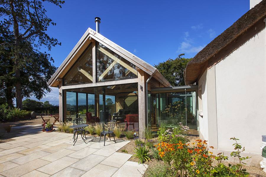 thatched home modern extension