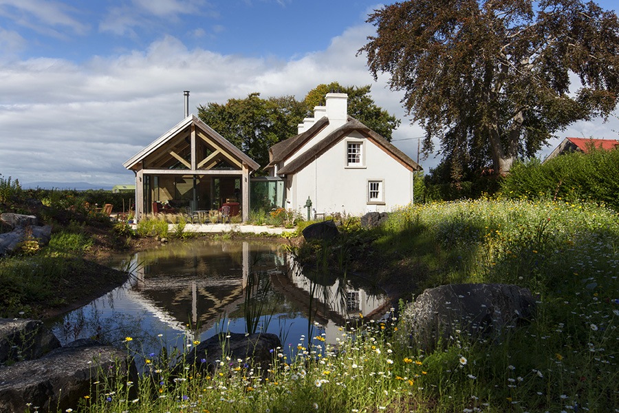 thatched home modern extension