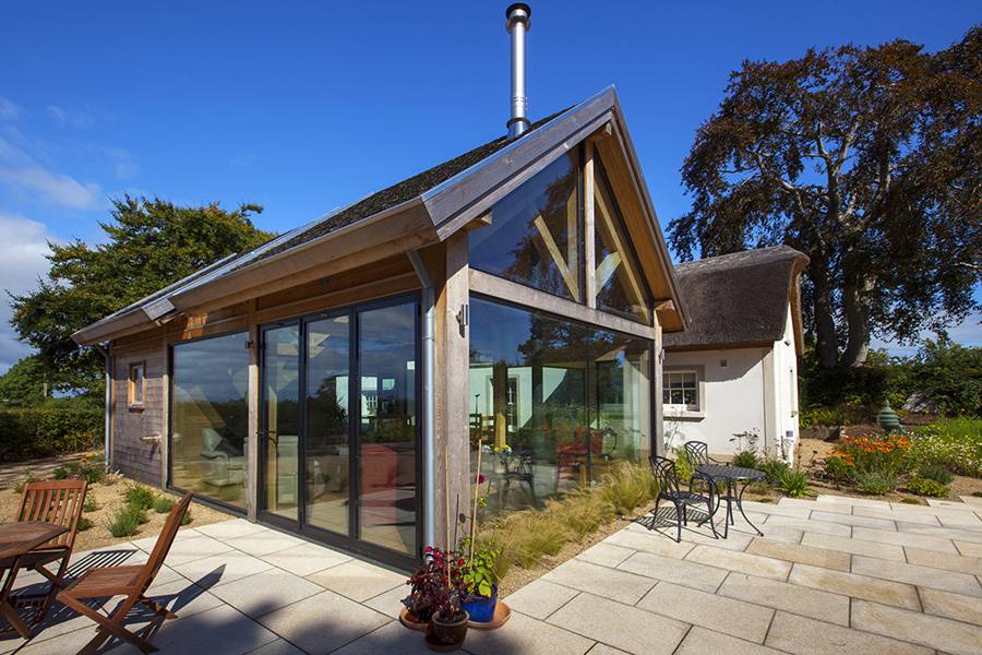 thatched home modern extension