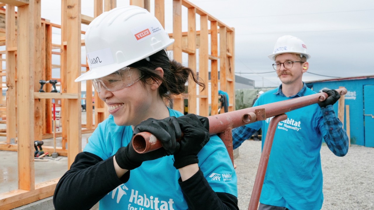Corporate partners volunteering on site with Habitat for Humanity Romania